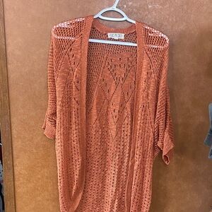 Pink Rose Open Knit Cardigan in coral.
